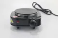 Compacte elektrische kookplaat met enkele brander en temperatuurknop voor laboratorium. - Zwart