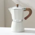 White aluminum moka pot with wooden handle, classic Italian espresso maker for home coffee lovers. - 1 Cup