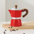 Red aluminum stovetop moka pot, classic octagonal espresso maker with wood-grain handle. - Red