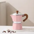 Pink small Italian aluminum moka pot, classic octagonal coffee maker with wood grain handle. - Pink