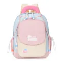 Detail shot of the cute color-block kids backpack with sweet patch and cozy pink handle. - Pink