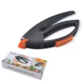 Multifunctional garlic presser with orange silicone grip, durable kitchen tool for home cooking. - Color Box