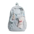 Niedlicher hellblauer Studentenrucksack mit transparenter Vordertasche und Plüschhase. - Musiknoten Edition / Blau