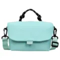 Detailed view of the mint green crossbody bag with black rope handle and hardware. - Blue