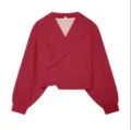 Detailed view of the stylish women wrap blouse featuring chic lapel and long lantern sleeves. - XS / Tops / Red