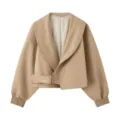 Detail view of stylish beige cropped jacket featuring wide lapel collar and waist belt buckle. - XS / Tops / Khaki