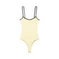 Detail view of the light yellow ribbed bodysuit with dark brown contrast trim and slim straps. - XS / Tops / Yellow