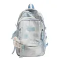 Front view of blue tie-dye fashion backpack with a cute plush bunny keychain - Blue