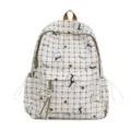 Detail view of cute plaid backpack featuring cartoon bear patterns and multi-pocket design - Khaki