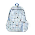 Blue and white plaid student backpack featuring cute cartoon puppy and star patterns - Blue