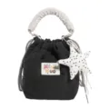 Close-up of a Japanese style black nylon bucket bag featuring a cute polka dot star pendant - Black