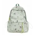 Light green plaid student backpack featuring cute cartoon bear patterns and front pocket - Green