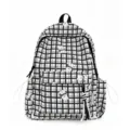 Detail view showing the front of a checkered student backpack with cute cartoon bear patterns - Black