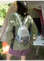 Close-up back view of a mini fashion outdoor sports backpack being worn in a camp - With Lanyard / S / Blue