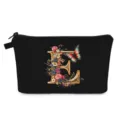 Beauty case nero con lettera E dorata e stampa di fiori e farfalle. - Stile E
