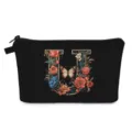 Borsa da trucco nera portatile con un'elegante lettera U floreale e un design a farfalla. - Stile U