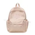 Detailansicht des rosa Sternenmusters Rucksacks mit Blumenstickerei und Sternanhänger - Rosa