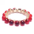 Red crystal beaded stretch bracelet with gold-tone settings, stylish fashion jewelry accessory. - Red