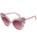 Pink heart-shaped sunglasses with floral rhinestone embellishments and gradient lenses. - Translucent Pink Frame Gradient Pink