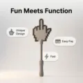 Detail shot of the pixelated middle finger tap to pay wand showing unique handle design. - Gray