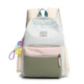 Front view detail of a nylon color-block school backpack for girls with cute star charm - With Charm / L / Light Blue