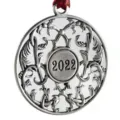 Silver metal Christmas tree ornament with intricate scrollwork and 2022 year stamp. - 2022
