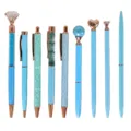 Set of 9 stylish blue ballpoint pens with rose gold accents and unique decorative tops. - Light Blue