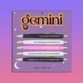 Close-up view of Gemini zodiac ballpoint pen set with five pens featuring fun quotes on a card. - Gemini / 5 Pcs Set