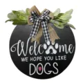 Wooden dog welcome door sign detail, rustic buffalo plaid bow and green leaves hanging decor. - Dog Tag / 30cm