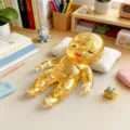 Gold glitter slow rebound squeeze baby doll stress relief toy for relaxing desk decor. - OPP Bag / Yellow