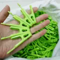 Green plastic clothes pegs bulk pack, sturdy utility clips with metal spring for home laundry drying. - Green (Pair of Clips)