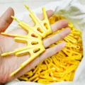 Yellow plastic clothes clips with metal rings, durable laundry pins for home and travel use. - Yellow (Pair of Clips)
