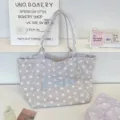 Detailed view of gray star-patterned canvas tote bag featuring Lucky letter embroidery. - Star Pattern / Gray