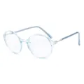Stilvolle Retro-Rundbrille mit hellblauem transparentem Rahmen und Metallbügeln - Transparenter blauer Rahmen