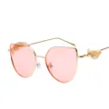 Stylish retro sunglasses featuring golden relief wings and trendy pink tinted lenses - Retro Embossed Wing Style (C2) / Gold Frame Pink Lens