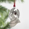 Metal angel Christmas tree ornament detailed close-up featuring red heart pendant holiday decor. - Little Angel