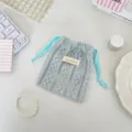 Macro view of organized light blue lace drawstring pouch for cosmetics and small items - Blue