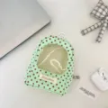 Detailed view of mint green polka dot plushie display bag with clear window - Case Only / Green