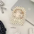 Detailed view of the cream polka dot doll storage display pouch featuring a clear window - Bag With Sheep Toy / Beige