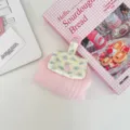 Close-up of floral quilted coin purse with snap button for lipstick and earphones - Light Pink