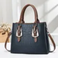 Elegant dark blue crocodile embossed handbag with brown handles and silver buckles - Blue