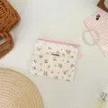 Detailed top view of floral storage pouch featuring white lace trim and pink zipper - Pink Floral