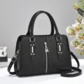 Elegante borsa a mano nera goffrata a rombi con dettagli dorati e tracolla - Nero