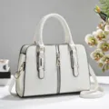 Elegant white rhombus embossed handbag with gold hardware and top handle for ladies - Off White