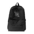 Close-up detail of the black grid student backpack featuring front white embroidery text. - L / Black