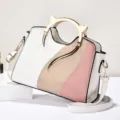 Chic colorblock shoulder bag with metal cat ear handle, stylish everyday women handbag variant. - White