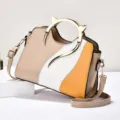 Chic color-blocked women's crossbody handbag with unique metal cat ear handle and strap. - Khaki