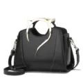 Stylish black women handbag with unique gold metal cat ear handle and contrast white stitching. - Oily Black