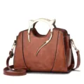 Stylish brown women shoulder handbag with unique gold cat ear metal handle for daily commute - Oily Earth Yellow