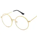 Occhiali rotondi vintage in metallo da donna con lenti trasparenti e aste finemente lavorate. - Montatura Oro C5